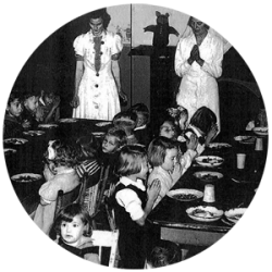 Historical image of children eating in dinning hall