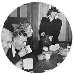 Historical image of women serving tea to men